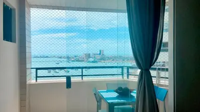 Uma área de estar em Flat Golden Flat Fortaleza