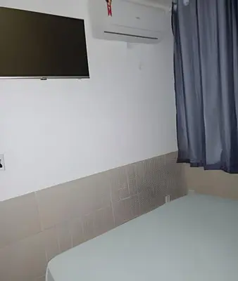 Uma cama ou camas num quarto em Flat Grand Praia de Iracema
