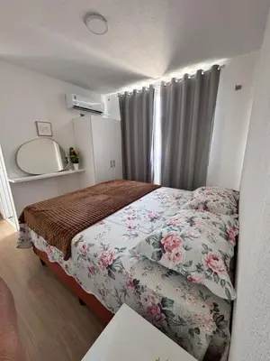 Uma cama ou camas num quarto em MIRANTE Clube 803 T3