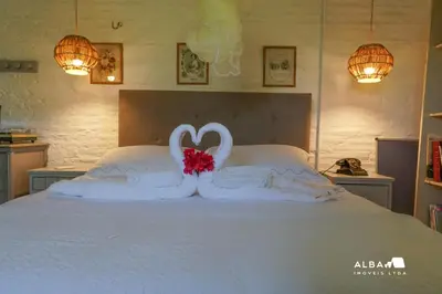 Uma cama ou camas num quarto em Vila Alba