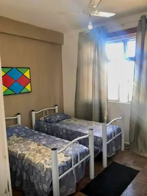 Uma cama ou camas num quarto em Seu descanso frente ao mar