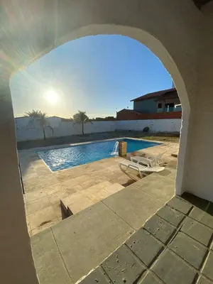A piscina em ou perto de Casa com piscina próxima a praia de Águas Belas