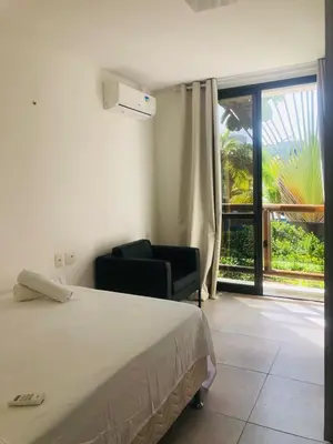 Uma cama ou camas num quarto em WAI WAI Cumbuco - Frente a Praia
