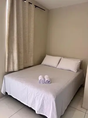 Uma cama ou camas num quarto em Pousada Meu Aconchego