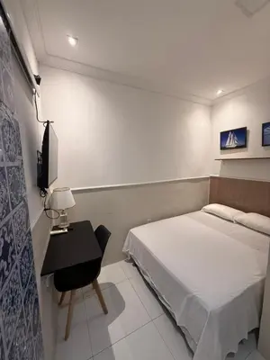 Uma televisão e/ou sistema de entretenimento em Pousada Meu Aconchego