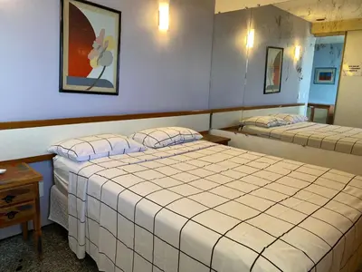 Uma cama ou camas num quarto em VISTA deslumbrante Avenida Beira Mar Meireles Mucuripe