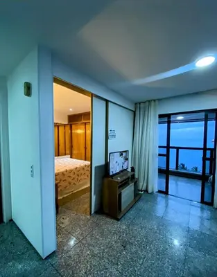 Uma cama ou camas num quarto em VISTA deslumbrante Avenida Beira Mar Meireles Mucuripe