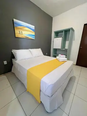 Uma cama ou camas num quarto em Vila do Sol Pousada