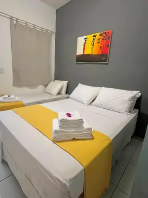 Uma cama ou camas num quarto em Vila do Sol Pousada
