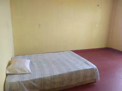 Uma cama ou camas num quarto em ICARAI CLUBE DE VERANEIO HOTEL E Turismo