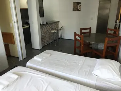 Uma cama ou camas num quarto em Flat atlantico 1102