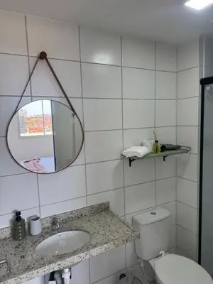 Uma casa de banho em Apartamento em frente à praia conforto completo