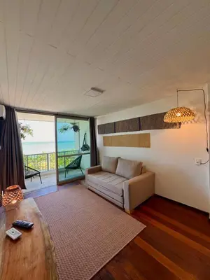 Uma cama ou camas num quarto em Beira Mar - Apartamento COM VISTA e SEM VISTA MAR