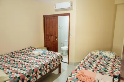Uma cama ou camas num quarto em Recanto Preocupação Zero