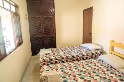 Uma cama ou camas num quarto em Recanto Preocupação Zero