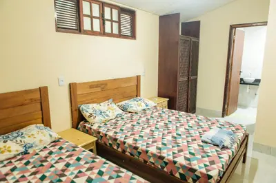 Uma cama ou camas num quarto em Recanto Preocupação Zero