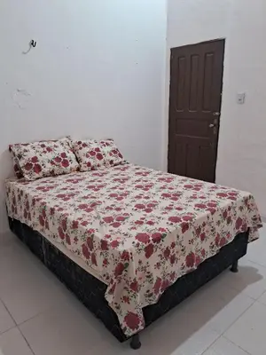 Uma cama ou camas num quarto em Casa Fundo de Quintal