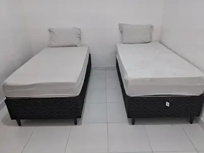 Uma cama ou camas num quarto em Casa Fundo de Quintal