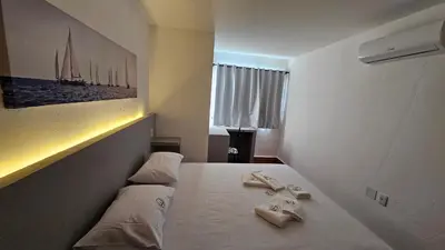Uma cama ou camas num quarto em Chalés Mediterraneo