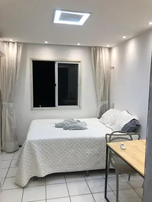 Uma cama ou camas num quarto em Flat vista frontal da praia de Iracema