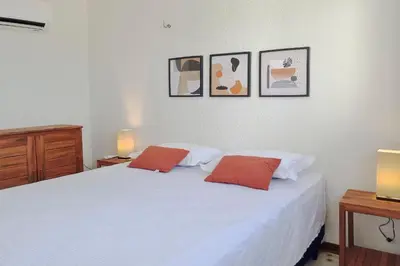 Uma cama ou camas num quarto em The Point Bangalô Pé na Areia em Fortim By Carpediem