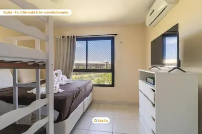 Uma cama ou camas num quarto em Último andar no VG Sun com acesso a praia