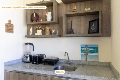 A cozinha ou kitchenette de Último andar no VG Sun com acesso a praia