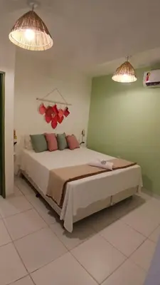 Uma cama ou camas num quarto em Villa Hê