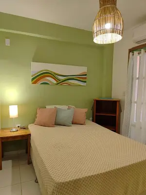 Uma cama ou camas num quarto em Villa Hê
