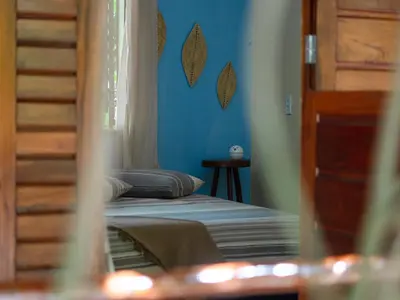Uma cama ou camas num quarto em Casa de hóspedes Balibar Cumbuco