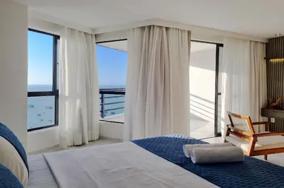 Uma cama ou camas num quarto em Iate Plaza #1404 - Studio vista mar by Carpediem