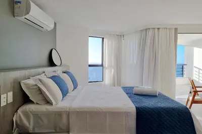 Uma cama ou camas num quarto em Iate Plaza #1404 - Studio vista mar by Carpediem