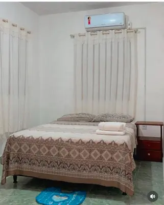 Uma cama ou camas num quarto em Chalé R&M
