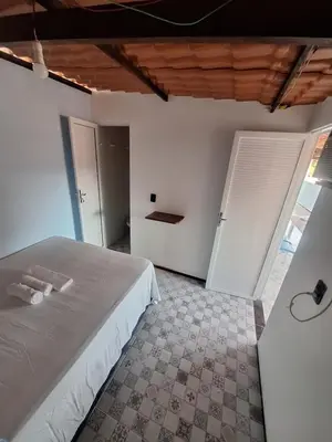 Uma cama ou camas num quarto em Pousada São João
