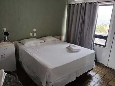 Uma cama ou camas num quarto em 506 Flat mobiliado Praia de Iracema