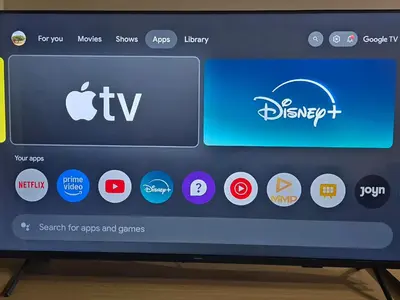 Uma televisão e/ou sistema de entretenimento em Beachfront Apartment 424A - 424B Kariri Beach