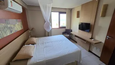Uma televisão e/ou sistema de entretenimento em Beachfront Ap 424B for 2 persons in Kariri Beach Residence