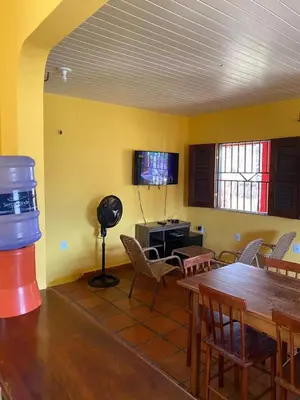 Uma televisão e/ou sistema de entretenimento em Jericoarcoara Family House