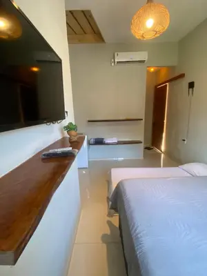 Uma cama ou camas num quarto em Flecheiras Suite