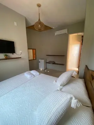 Uma cama ou camas num quarto em Flecheiras Suite