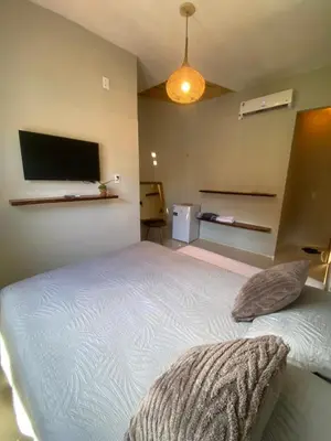 Uma cama ou camas num quarto em Flecheiras Suite