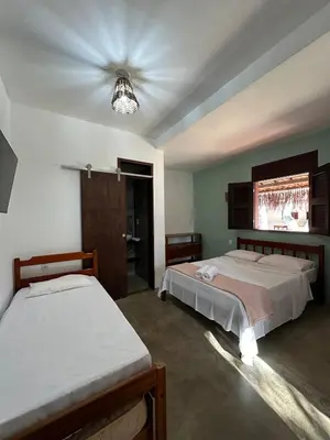 Uma cama ou camas num quarto em Vila Lua Aparts - Apartamento 1