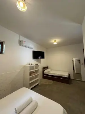 Uma cama ou camas num quarto em Vila Lua Aparts - Apartamento 3
