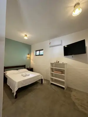 Uma cama ou camas num quarto em Vila Lua Aparts - Apartamento 3