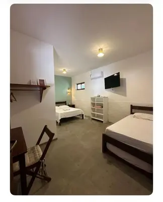 Uma televisão e/ou sistema de entretenimento em Vila Lua Aparts - Apartamento 4