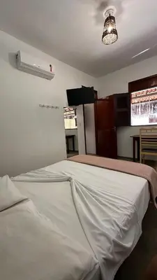 Uma cama ou camas num quarto em Vila Lua Aparts - Apartamento 6