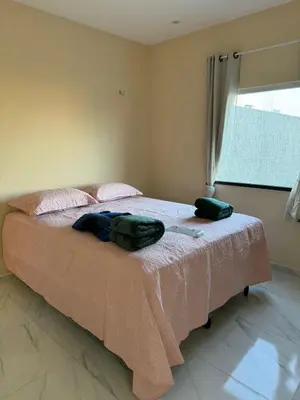 Uma cama ou camas num quarto em Linda Casa Aconchegante Aquiraz