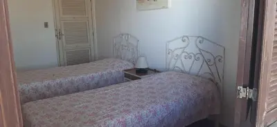 Uma cama ou camas num quarto em Grande Casa de Praia na Caponga - Ceará
