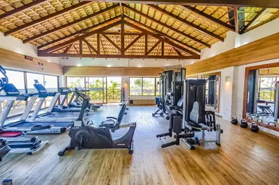 O centro de fitness e/ou as comodidades de fitness de Beach Place Resort Bangalo 12