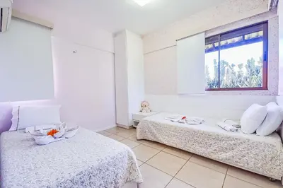 Uma cama ou camas num quarto em Beach Place Resort Bangalo 12